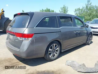 2014 Honda Odyssey Touring with VIN 5FNRL5H90EB082691, listed as a IAAI auction lot 42572977 with 54,413 mi miles and . Bid and sale history available at DreamBid. Image 4.