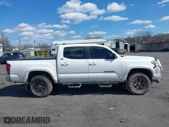 2020 Toyota Tacoma SR5 with VIN 3TMCZ5AN5LM339977, listed as a IAAI auction lot 41886937 with 94,986 mi miles and . Bid and sale history available at DreamBid. Image 13.