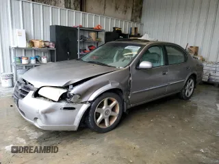 2001 Nissan Maxima SE z VIN JN1CA31A21T309782, wystawiony jako Copart lot #56696605 z przebiegiem 312 094 mil mil oraz Szkody całkowita. Historia ofert i sprzedaży dostępna na DreamBid. Obrazek 1.