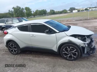2018 Toyota C-HR XLE with VIN JTNKHMBX3J1010211, listed as a IAAI auction lot 40799443 with 104,148 mi miles. Bid and sale history available at carsss.com. Image 14.
