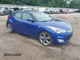 2012 Hyundai Veloster w/Gray Int z VIN KMHTC6AD6CU066313, wystawiony jako IAAI lot #42201240 z przebiegiem 158 084 mil mil oraz . Historia ofert i sprzedaży dostępna na DreamBid. Obrazek 1.