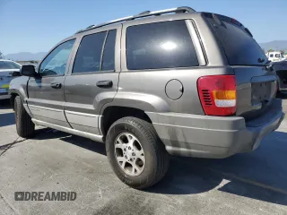 2000 Jeep Grand Cherokee Laredo with VIN 1J4G248S2YC377133, listed as a Copart auction lot 57916785 with 217,525 mi miles and Salvage title. Bid and sale history available at DreamBid. Image 2.