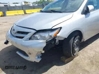 2011 Toyota Corolla L with VIN 2T1BU4EE1BC572731, listed as a IAAI auction lot 42024851 with 153,923 mi miles. Bid and sale history available at carsss.com. Image 6.