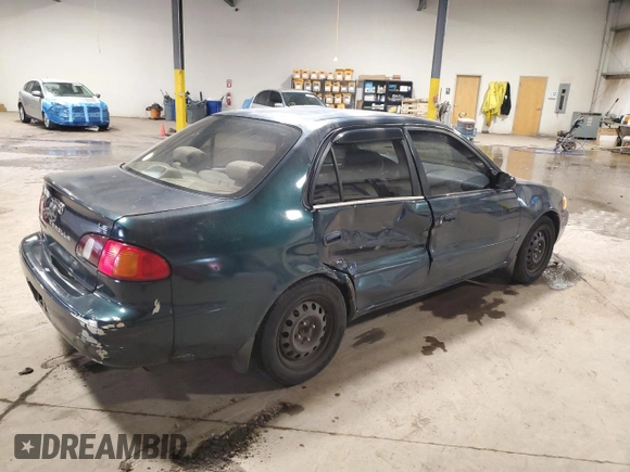 1999 Toyota Corolla VE with VIN 2T1BR12E2XC136739, listed as a Copart auction lot 60693625 with 170,989 mi miles and Salvage title. Bid and sale history available at DreamBid. Image 3.