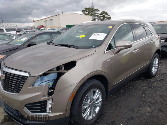 2023 Cadillac XT5 FWD Luxury z VIN 1GYKNAR45PZ140440, wystawiony jako IAAI lot #41723317 z przebiegiem 25 124 mil mil oraz . Historia ofert i sprzedaży dostępna na DreamBid. Obrazek 2.