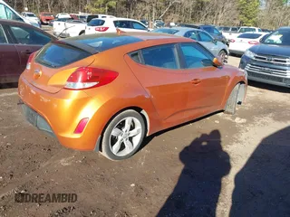 2013 Hyundai Veloster w/Gray Int with VIN KMHTC6AD3DU126193, listed as a IAAI auction lot 41251982 with 119,066 mi miles. Bid and sale history available at carsss.com. Image 4.
