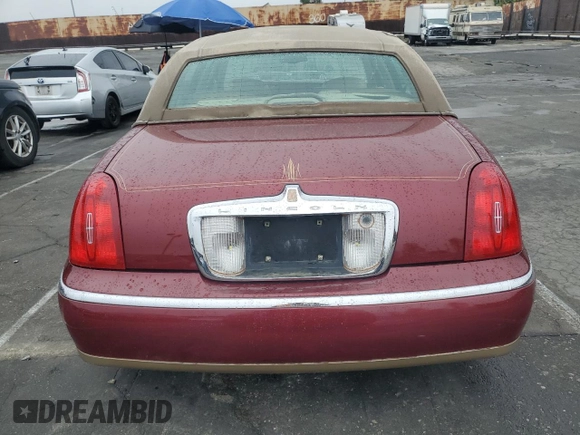 1999 Lincoln Town Car Signature with VIN 1LNHM82W7XY612906, listed as a Copart auction lot 50777435 with 110,414 mi miles and Salvage title. Bid and sale history available at DreamBid. Image 6.