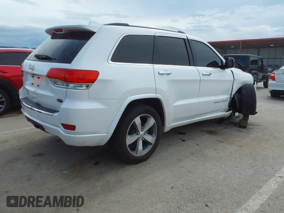 2016 Jeep Grand Cherokee Overland with VIN 1C4RJFCG2GC490420, listed as a IAAI auction lot 42200700 with 97,007 mi miles and . Bid and sale history available at DreamBid. Image 4.