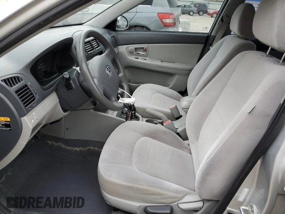 2009 Kia Spectra EX with VIN KNAFE221595657550, listed as a Copart auction lot 52805205 with 95,777 mi miles and Salvage Title. Bid and sale history available at DreamBid. Image 7.