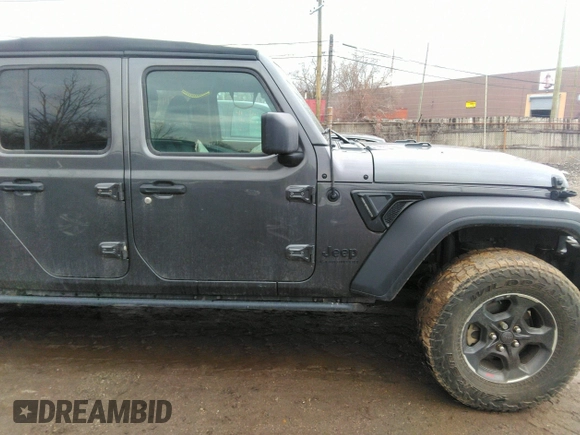 2021 Jeep Gladiator Sport S z VIN 1C6HJTAG3ML597041, wystawiony jako IAAI lot #41714640 z przebiegiem 46 402 mil mil oraz . Historia ofert i sprzedaży dostępna na DreamBid. Obrazek 13.