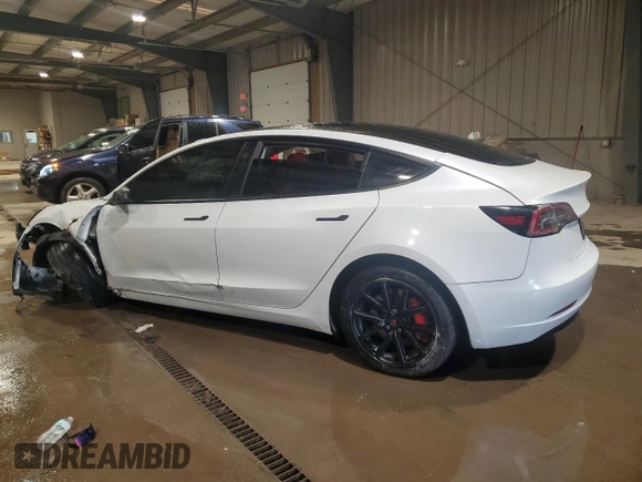 2021 Tesla Model 3 Standard Range Plus with VIN 5YJ3E1EA5MF987000, listed as a Copart auction lot 87638485 with Not Provided miles and Salvage Title. Bid and sale history available at DreamBid. Image 2.
