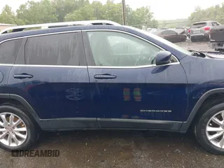 2014 Jeep Cherokee Limited with VIN 1C4PJMDS0EW277301, listed as a IAAI auction lot 42357034 with 61,825 mi miles and . Bid and sale history available at DreamBid. Image 13.