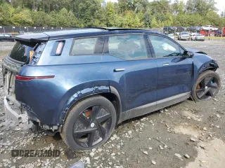 2023 Fisker Ocean One z VIN VCF1ZBU23PG004403, wystawiony jako Copart lot #69169144 z przebiegiem Nie podano mil oraz Szkody całkowita. Historia ofert i sprzedaży dostępna na DreamBid. Obrazek 3.