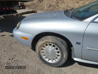 1999 Mercury Sable LS z VIN 1MEFM53S7XA622932, wystawiony jako IAAI lot #41708531 z przebiegiem 155 702 mil mil oraz . Historia ofert i sprzedaży dostępna na DreamBid. Obrazek 14.