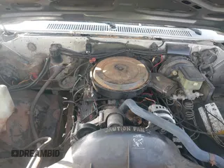1991 GMC Suburban z VIN 1GKEV16K7MF512125, wystawiony jako IAAI lot #41634112 z przebiegiem 256 640 mil mil oraz . Historia ofert i sprzedaży dostępna na DreamBid. Obrazek 10.