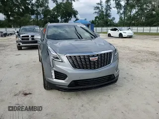 2023 Cadillac XT5 FWD Luxury z VIN 1GYKNAR4XPZ144533, wystawiony jako Copart lot #74734164 z przebiegiem Nie podano mil oraz Nie do naprawy • Non repairable. Historia ofert i sprzedaży dostępna na DreamBid. Obrazek 11.