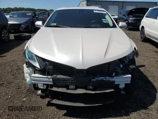 2015 Lincoln MKZ z VIN 3LN6L2JK8FR616661, wystawiony jako Copart lot #61588325 z przebiegiem 65 382 mil mil oraz Szkoda całkowita • Salvage title. Historia ofert i sprzedaży dostępna na DreamBid. Obrazek 5.