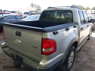 2007 Ford Explorer Sport Trac XLT with VIN 1FMEU51K47UA09905, listed as a IAAI auction lot 42063335 with 156,987 mi miles. Bid and sale history available at carsss.com. Image 4.