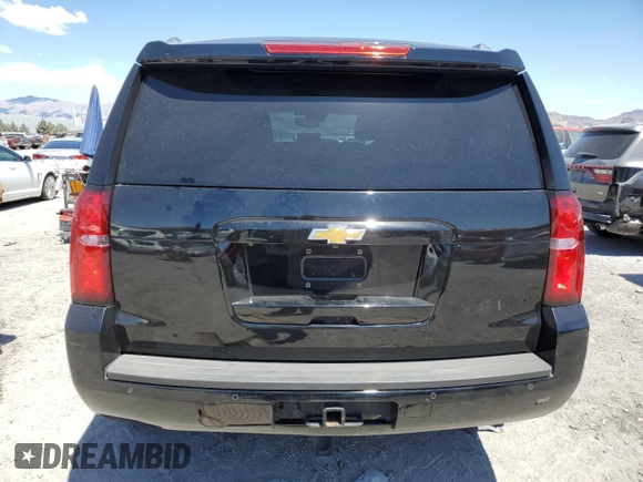 2015 Chevrolet Tahoe LT with VIN 1GNSCBKC6FR297726, listed as a Copart auction lot 55097475 with 114,471 mi miles and Salvage title. Bid and sale history available at DreamBid. Image 6.