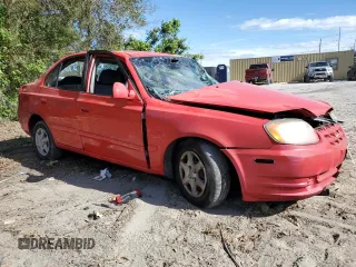 2005 Hyundai Accent GLS with VIN KMHCG45CX5U618473, listed as a Copart auction lot 76752994 with 0 mi miles and Salvage Title. Bid and sale history available at carsss.com. Image 4.