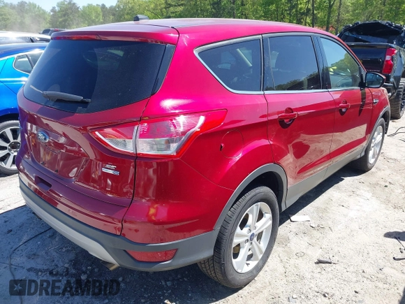 2016 Ford Escape SE with VIN 1FMCU9GX9GUC71209, listed as a IAAI auction lot 42037642 with 82,521 mi miles and . Bid and sale history available at DreamBid. Image 4.