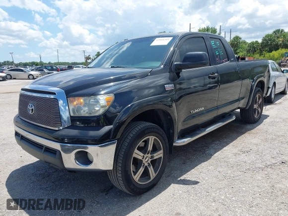 2012 Toyota Tundra z VIN 5TFRY5F17CX128888, wystawiony jako IAAI lot #42508395 z przebiegiem 279 524 mil mil oraz . Historia ofert i sprzedaży dostępna na DreamBid. Obrazek 2.