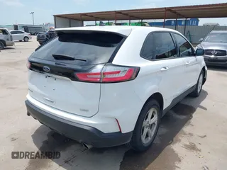 2020 Ford Edge SE z VIN 2FMPK3G90LBB05473, wystawiony jako IAAI lot #42447819 z przebiegiem 69 612 mil mil oraz . Historia ofert i sprzedaży dostępna na DreamBid. Obrazek 4.
