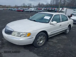 1998 Lincoln Continental with VIN 1LNFM97V2WY738814, listed as a IAAI auction lot 41992844 with 147,066 mi miles. Bid and sale history available at carsss.com. Image 2.