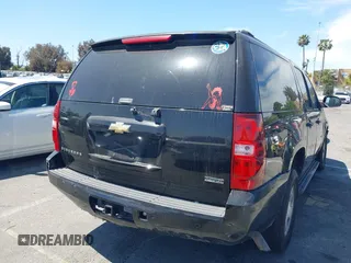 2011 Chevrolet Suburban LT with VIN 1GNSCJE0XBR285973, listed as a IAAI auction lot 42007844 with 252,994 mi miles. Bid and sale history available at carsss.com. Image 4.