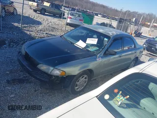 1999 Mazda 626 LX with VIN 1YVGF22DXX5847298, listed as a IAAI auction lot 41236165 with 194,445 mi miles. Bid and sale history available at carsss.com. Image 2.
