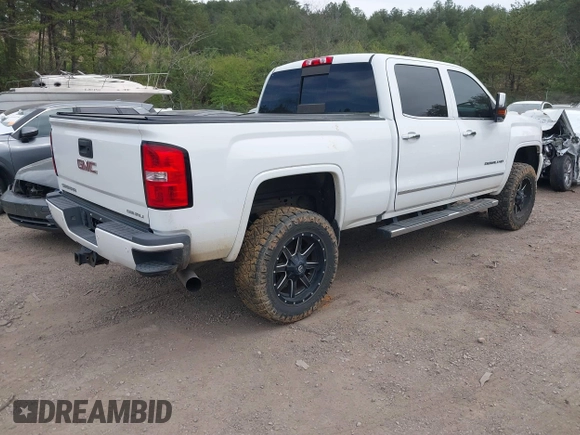 2016 GMC Sierra 2500HD Denali z VIN 1GT12UE82GF130096, wystawiony jako IAAI lot #41869448 z przebiegiem 129 659 mil mil oraz . Historia ofert i sprzedaży dostępna na DreamBid. Obrazek 4.