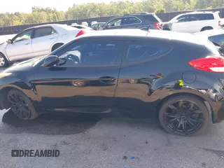 2012 Hyundai Veloster w/Black Int z VIN KMHTC6AD4CU078413, wystawiony jako IAAI lot #42611032 z przebiegiem 142 295 mil mil oraz . Historia ofert i sprzedaży dostępna na DreamBid. Obrazek 14.
