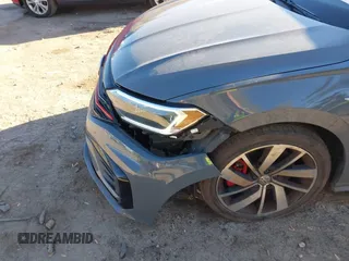 2019 Volkswagen Jetta GLI S z VIN 3VW6T7BU5KM169132, wystawiony jako IAAI lot #41599605 z przebiegiem 59 744 mil mil oraz . Historia ofert i sprzedaży dostępna na DreamBid. Obrazek 6.