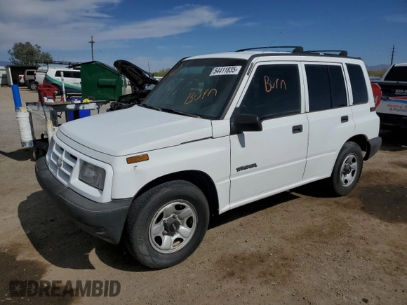 1996 Geo Tracker z VIN 2CNBE1364T6909947, wystawiony jako Copart lot #54411835 z przebiegiem 171 862 mil mil oraz Szkoda całkowita • Salvage title. Historia ofert i sprzedaży dostępna na DreamBid. Obrazek 1.