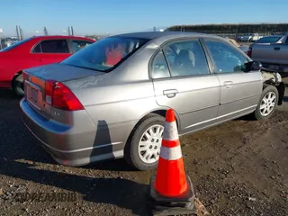 2004 Honda Civic LX with VIN 2HGES15594H525975, listed as a IAAI auction lot 41266024 with 241,598 mi miles. Bid and sale history available at carsss.com. Image 4.