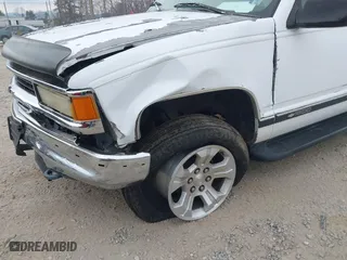 1997 Chevrolet Tahoe with VIN 1GNEK13R4VJ361515, listed as a IAAI auction lot 41768386 with 216,974 mi miles. Bid and sale history available at carsss.com. Image 12.
