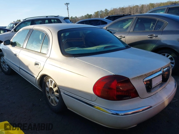 2001 Lincoln Continental with VIN 1LNHM97V71Y670611, listed as a IAAI auction lot 41385621 with 141,714 mi miles. Bid and sale history available at carsss.com. Image 3.