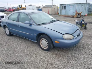 1999 Mercury Sable LS z VIN 1MEFM53S5XA647862, wystawiony jako IAAI lot #41762714 z przebiegiem 165 490 mil mil oraz . Historia ofert i sprzedaży dostępna na DreamBid. Obrazek 1.