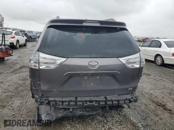 2014 Toyota Sienna SE with VIN 5TDXK3DC3ES470042, listed as a Copart auction lot 49254335 with 99,208 mi miles and Salvage Title. Bid and sale history available at DreamBid. Image 6.