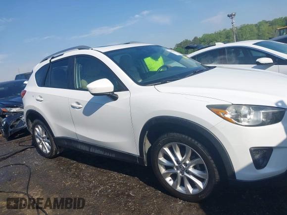 2014 Mazda CX-5 Grand Touring with VIN JM3KE2DY1E0424890, listed as a IAAI auction lot 42052437 with 107,793 mi miles. Bid and sale history available at carsss.com. Image 13.