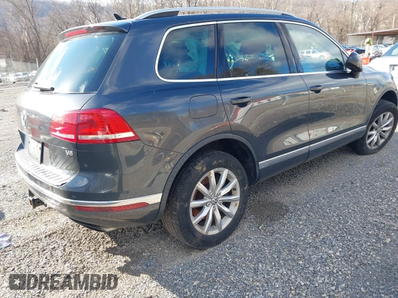 2016 Volkswagen Touareg Sport with VIN WVGEF9BP2GD005315, listed as a IAAI auction lot 41588590 with 134,709 mi miles and . Bid and sale history available at DreamBid. Image 4.