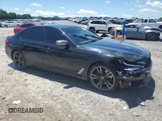2019 BMW 5 Series M550i xDrive with VIN WBAJB9C53KB289356, listed as a Copart auction lot 57814535 with 60,454 mi miles and Clean title. Bid and sale history available at DreamBid. Image 4.