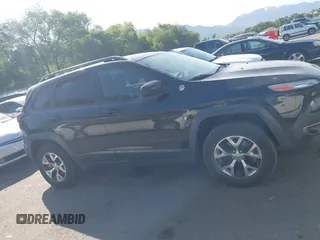 2015 Jeep Cherokee Trailhawk with VIN 1C4PJMBS4FW556822, listed as a IAAI auction lot 42412874 with 129,865 mi miles and . Bid and sale history available at DreamBid. Image 13.