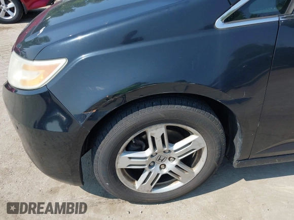 2011 Honda Odyssey Touring with VIN 5FNRL5H97BB073708, listed as a IAAI auction lot 42409164 with 141,986 mi miles and . Bid and sale history available at DreamBid. Image 6.