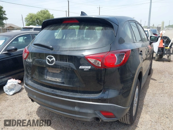 2016 Mazda CX-5 Sport with VIN JM3KE2BY8G0847018, listed as a IAAI auction lot 42064726 with 69,017 mi miles and . Bid and sale history available at DreamBid. Image 4.