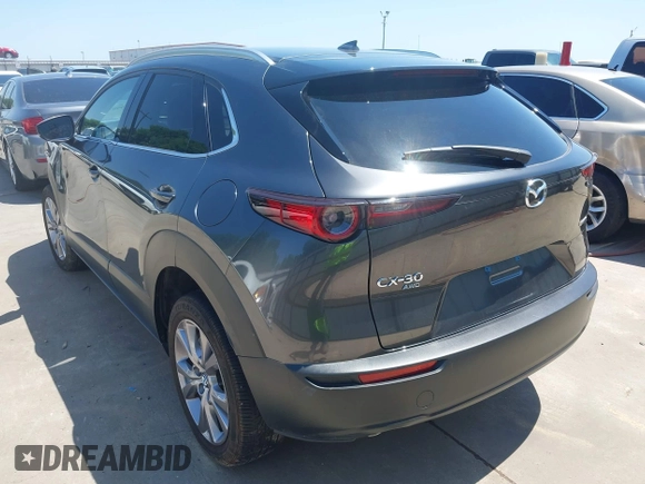 2022 Mazda CX-30 S Premium with VIN 3MVDMBDL5NM416649, listed as a IAAI auction lot 41990745 with 13,923 mi miles and . Bid and sale history available at DreamBid. Image 3.