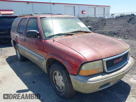 2000 GMC Jimmy SL with VIN 1GKCS13W9Y2264710, listed as a IAAI auction lot 42136082 with 206,584 mi miles. Bid and sale history available at carsss.com. Image 1.