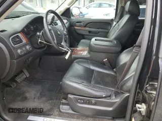 2014 Chevrolet Tahoe LTZ with VIN 1GNSKCE0XER228028, listed as a Copart auction lot 56971135 with 155,285 mi miles and Salvage title. Bid and sale history available at DreamBid. Image 7.