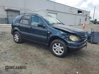 2000 Mercedes-Benz M 320/430/500 with VIN 4JGAB72E7YA168445, listed as a Copart auction lot 59401235 with 231,591 mi miles and Salvage title. Bid and sale history available at DreamBid. Image 4.