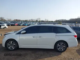 2014 Honda Odyssey Touring with VIN 5FNRL5H97EB037358, listed as a IAAI auction lot 41832825 with 208,894 mi miles and . Bid and sale history available at DreamBid. Image 14.